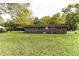 Brick ranch house with a large backyard and mature trees at 3657 Highway 472, Conway, SC 29526