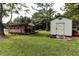 Two sheds in a grassy backyard, one is metal and the other is wood at 3657 Highway 472, Conway, SC 29526