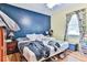 Main bedroom with dark blue accent wall and queen-size bed at 3657 Highway 472, Conway, SC 29526