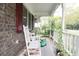Front porch with rocking chairs and plants at 3657 Highway 472, Conway, SC 29526