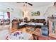 Living room with hardwood floors, brown sofas, and partial dining room view at 3657 Highway 472, Conway, SC 29526