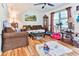 Living room with hardwood floors, brown sofas, and Gathering toys at 3657 Highway 472, Conway, SC 29526