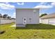 Backyard features a concrete patio, privacy fence, and grassy area, creating an ideal outdoor space at 395 Thistle Ln., Myrtle Beach, SC 29579