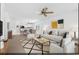 Cozy living room with modern decor, neutral carpet, ceiling fan, and adjacent dining area at 395 Thistle Ln., Myrtle Beach, SC 29579