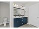 Elegant bathroom featuring a double vanity and large mirror at 403 Mikita Dr., Surfside Beach, SC 29575