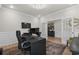 Home office with desk, chair, and double French doors at 403 Mikita Dr., Surfside Beach, SC 29575