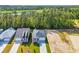 Aerial view of the house, neighborhood, and surrounding trees at 409 Sun Colony Blvd., Longs, SC 29568
