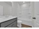 Modern bathroom featuring a vanity, toilet, and shower-tub combo with white tile at 409 Sun Colony Blvd., Longs, SC 29568