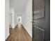 Bright hallway with wood flooring, leading to other rooms in the house at 409 Sun Colony Blvd., Longs, SC 29568