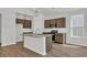 Modern kitchen featuring granite countertops, a center island, stainless steel appliances and wood cabinets at 409 Sun Colony Blvd., Longs, SC 29568