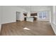 Open kitchen with hardwood floors, a kitchen island, and stainless steel appliances at 409 Sun Colony Blvd., Longs, SC 29568