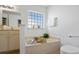 Bathroom with a bathtub and a large window at 4110 Fairway Dr., Little River, SC 29566