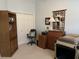 Versatile room with a wooden desk, bookcase, and pet carrier, adaptable for a home office or guest space at 414 Grand Cypress Way, Murrells Inlet, SC 29576
