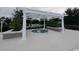 Community hot tub under a pergola, surrounded by well maintained landscaping at 414 Grand Cypress Way, Murrells Inlet, SC 29576