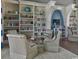 Community library featuring walls of bookshelves and comfortable seating for reading and relaxation at 414 Grand Cypress Way, Murrells Inlet, SC 29576