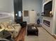 Cozy living room featuring a modern electric fireplace, neutral walls, and stylish, comfortable seating at 414 Grand Cypress Way, Murrells Inlet, SC 29576