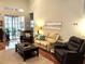 Spacious living room featuring hardwood floors, neutral paint, comfortable seating, and natural light at 414 Grand Cypress Way, Murrells Inlet, SC 29576