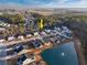 Aerial view of community homes near a pond, showcasing a well-maintained neighborhood with water features at 440 Craigflower Ct., Longs, SC 29568