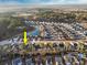 This aerial shot highlights a community with a beautiful pond and mature trees, perfect for peaceful living at 440 Craigflower Ct., Longs, SC 29568