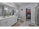 Elegant bathroom features a double vanity, large mirror, and a walk-in closet space at 440 Craigflower Ct., Longs, SC 29568