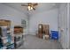 Bedroom with a ceiling fan and various boxes stacked in a corner, some packed for moving at 440 Craigflower Ct., Longs, SC 29568
