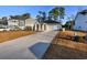 Charming one-story home featuring a two-car garage, long driveway, covered porch, and well-manicured front lawn at 440 Craigflower Ct., Longs, SC 29568