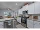 Well-lit kitchen featuring stainless steel appliances, gas range, and granite countertops at 440 Craigflower Ct., Longs, SC 29568
