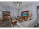 Spacious living room with hardwood floors, ceiling fan, and lots of comfortable seating at 440 Craigflower Ct., Longs, SC 29568