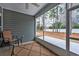 Screened-in patio with a ceiling fan, providing a relaxing outdoor space with a view at 440 Craigflower Ct., Longs, SC 29568