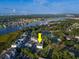Aerial view of community next to river, golf course, trees, and marshland at 4459 Turtle Ln. # 3D, Little River, SC 29566