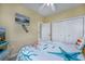 Charming bedroom featuring closet, dresser, and comfortable bed with coastal decor at 4459 Turtle Ln. # 3D, Little River, SC 29566