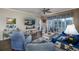 Cozy living room with comfortable seating, TV, and sliding glass doors leading to outdoor space at 4459 Turtle Ln. # 3D, Little River, SC 29566