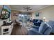 Relaxing living room featuring comfortable seating and outdoor views from sliding glass door at 4459 Turtle Ln. # 3D, Little River, SC 29566