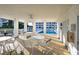 Pool cabana with tables and chairs overlooks the pool and condo buildings in a resort community at 4459 Turtle Ln. # 3D, Little River, SC 29566