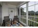 The large pane windows in the sun room have a great view of the golf course at 4459 Turtle Ln. # 3D, Little River, SC 29566