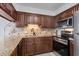 Well-equipped kitchen with granite counters and stainless steel appliances at 517 S Ocean Blvd. # 506, North Myrtle Beach, SC 29582