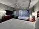 Two double beds and a bathroom visible in this well-lit bedroom at 5300 N Ocean Blvd. # 1005, Myrtle Beach, SC 29577