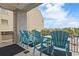 Enjoy a sunny morning on the balcony with turquoise chairs and great community views at 5825 Catalina Dr. # 332, North Myrtle Beach, SC 29582