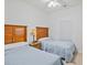 Bedroom with two twin beds, nightstand, ceiling fan at 5825 Catalina Dr. # 332, North Myrtle Beach, SC 29582