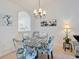 Dining area with glass table and patterned chairs at 5825 Catalina Dr. # 332, North Myrtle Beach, SC 29582