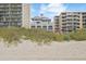 Oceanfront view of a luxurious residential building with balconies, situated between two high-rise buildings at 5825 Catalina Dr. # 332, North Myrtle Beach, SC 29582