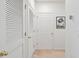 Bright hallway with two white doors and wall art at 5825 Catalina Dr. # 332, North Myrtle Beach, SC 29582