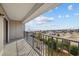 Spacious balcony featuring metal railings with views of the beach and clear blue skies at 5905 S Kings Hwy. # 312-C, Myrtle Beach, SC 29575