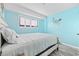 Bedroom featuring neutral paint, wood floors, and a decorative bedside table at 5905 S Kings Hwy. # 312-C, Myrtle Beach, SC 29575