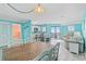 Comfortable dining and living area with stylish furniture, light gray flooring, and plenty of natural light at 5905 S Kings Hwy. # 312-C, Myrtle Beach, SC 29575