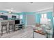 Bright living space with a bar-style kitchen, comfortable sofa, and access to a balcony at 5905 S Kings Hwy. # 312-C, Myrtle Beach, SC 29575