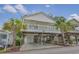 Elevated beach house with wrap-around porch and parking underneath at 6001-1830A S Kings Highway, Myrtle Beach, SC 29575
