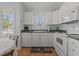 White cabinets, stainless steel appliances, and a galley-style layout at 6001-1830A S Kings Highway, Myrtle Beach, SC 29575