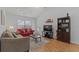 Bright living area with hardwood floors, couches, and a TV stand at 6001-1830A S Kings Highway, Myrtle Beach, SC 29575