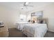 Bright bedroom with two twin beds, a ceiling fan, and beach-themed wall art at 627 Waterway Village Dr. # 8-I, Myrtle Beach, SC 29579